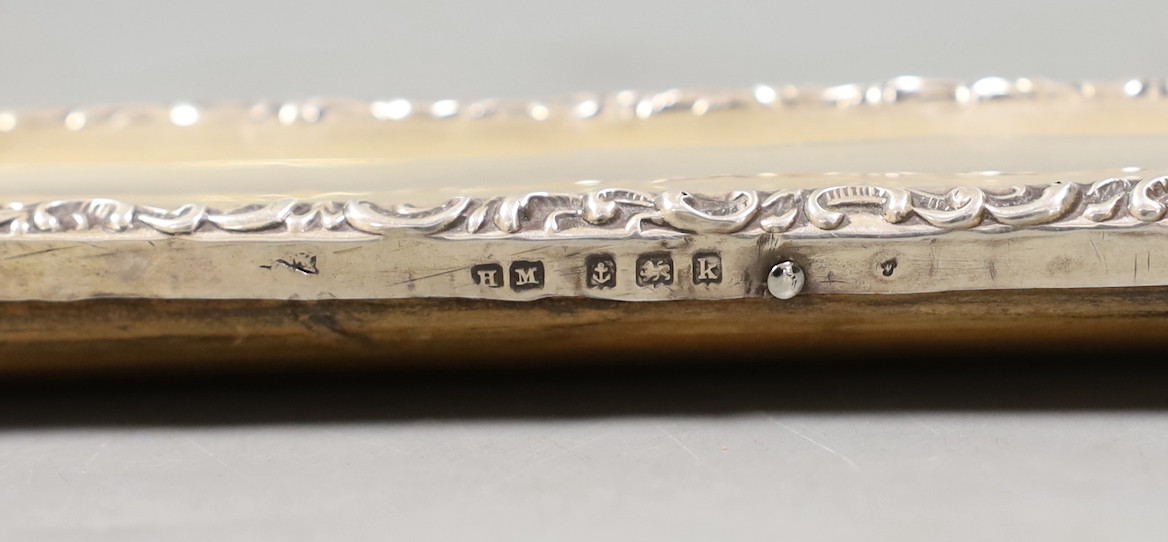 An Edwardian silver mounted rectangular photograph frame, Henry Matthews, Birmingham, 1909, 33.2cm.